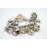 Silver charm bracelet including souvenir charms (127g)