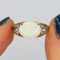 9ct gold opal single stone ring with diamond set shank (3g) Size N
