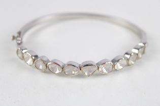 Silver gemstone bangle featuring multi cut stones (21g)