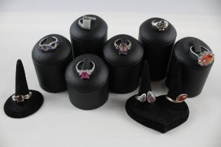 A collection of silver gemstone rings including Amber (41g)