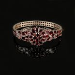 Antique garnet bangle, tombac, total weight 21.5g, set all around with antique Bohemian table garne