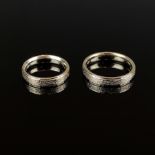 Pair of gold rings, 750/18K yellow gold (hallmarked), 8.7g, textured surface, each with engraving i