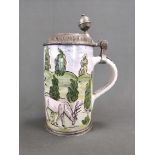A cylindrical jug with hunting scene, probably 18th century, with pewter mount, polychrome painted 