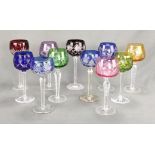 Convolute rummers / Römer, 11 glasses in different colours, bulbous bowl with cut decoration, sligh