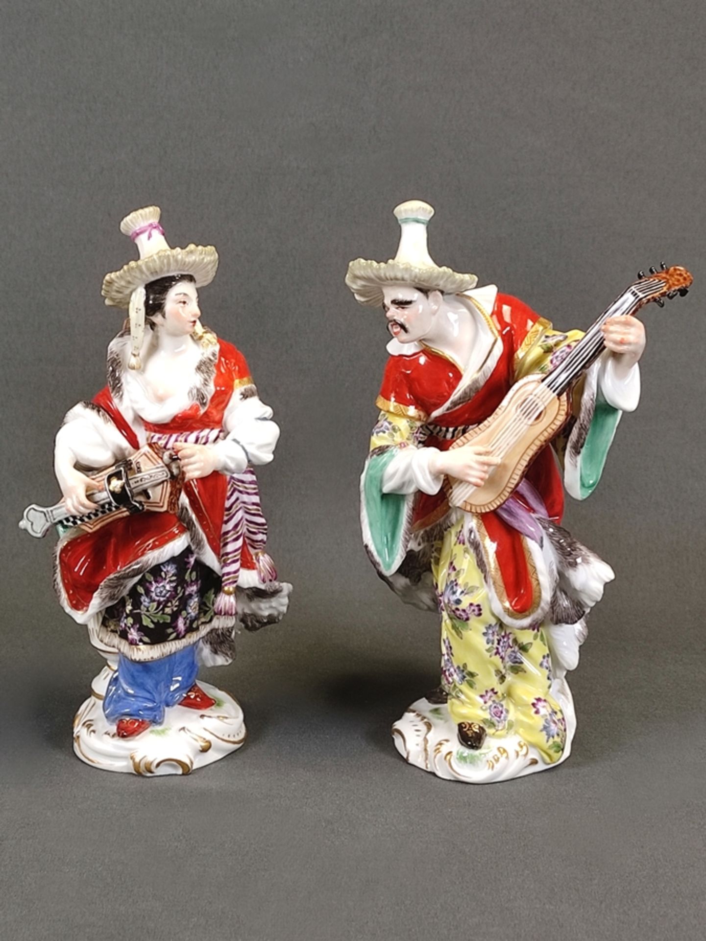 Porcelain pair "Malabarian man with lute" and "Malabarian woman with hurdy-gurdy", Meissen sword ma