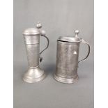 Two antique pewter pitchers, consisting of: Guild jug with lid, engraved with guild sign of the tai