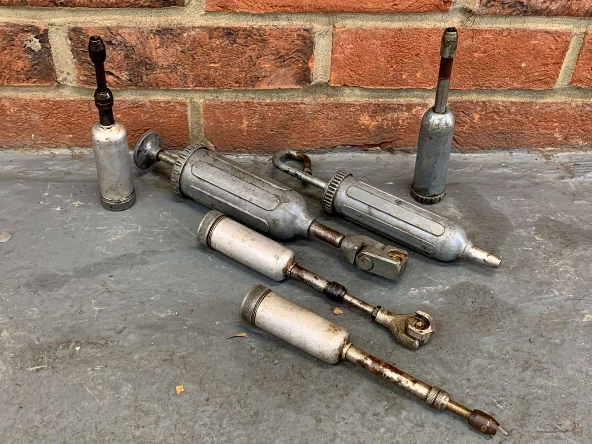 Six Vintage Grease Guns