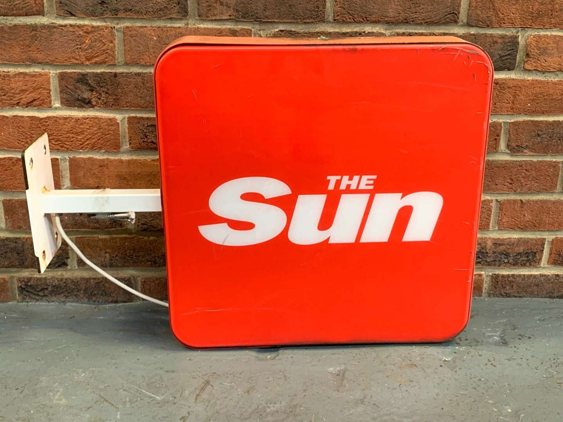 Illuminated “The Sun” Advertising Sign
