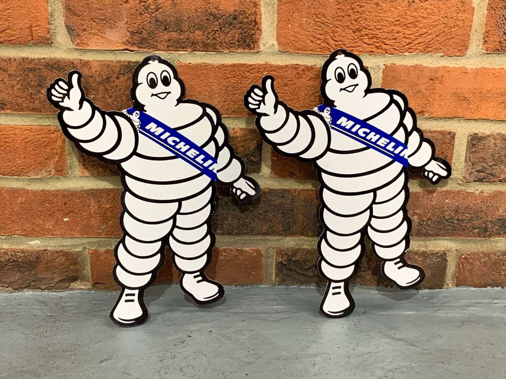 Pair of Metal Small Michelin Men Signs