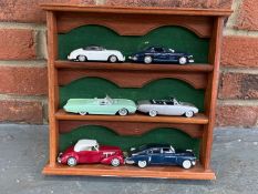 Display Case of Six Die Cast Model Cars