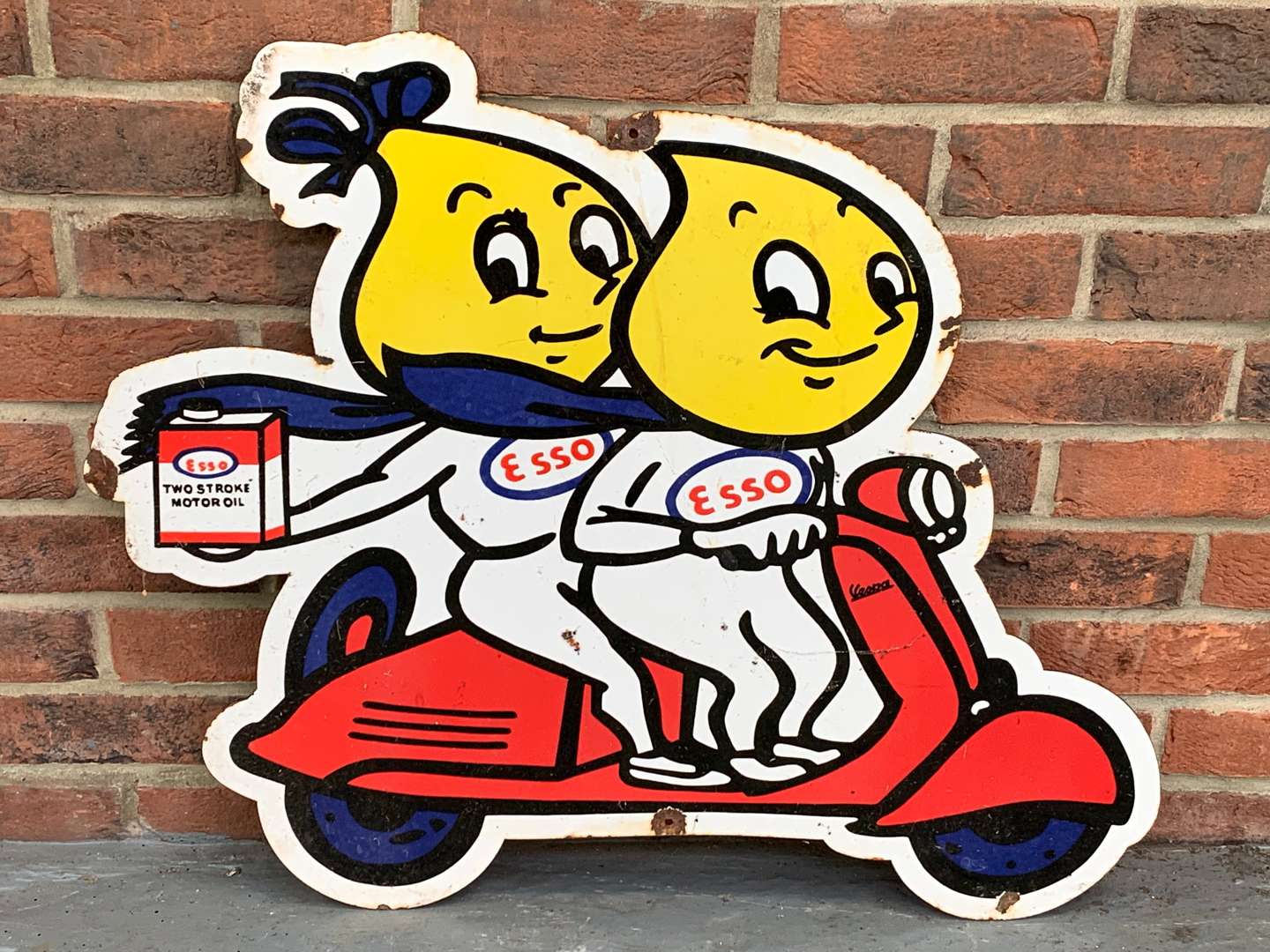 Enamel Mr and Mrs Drip on a Scooter Sign