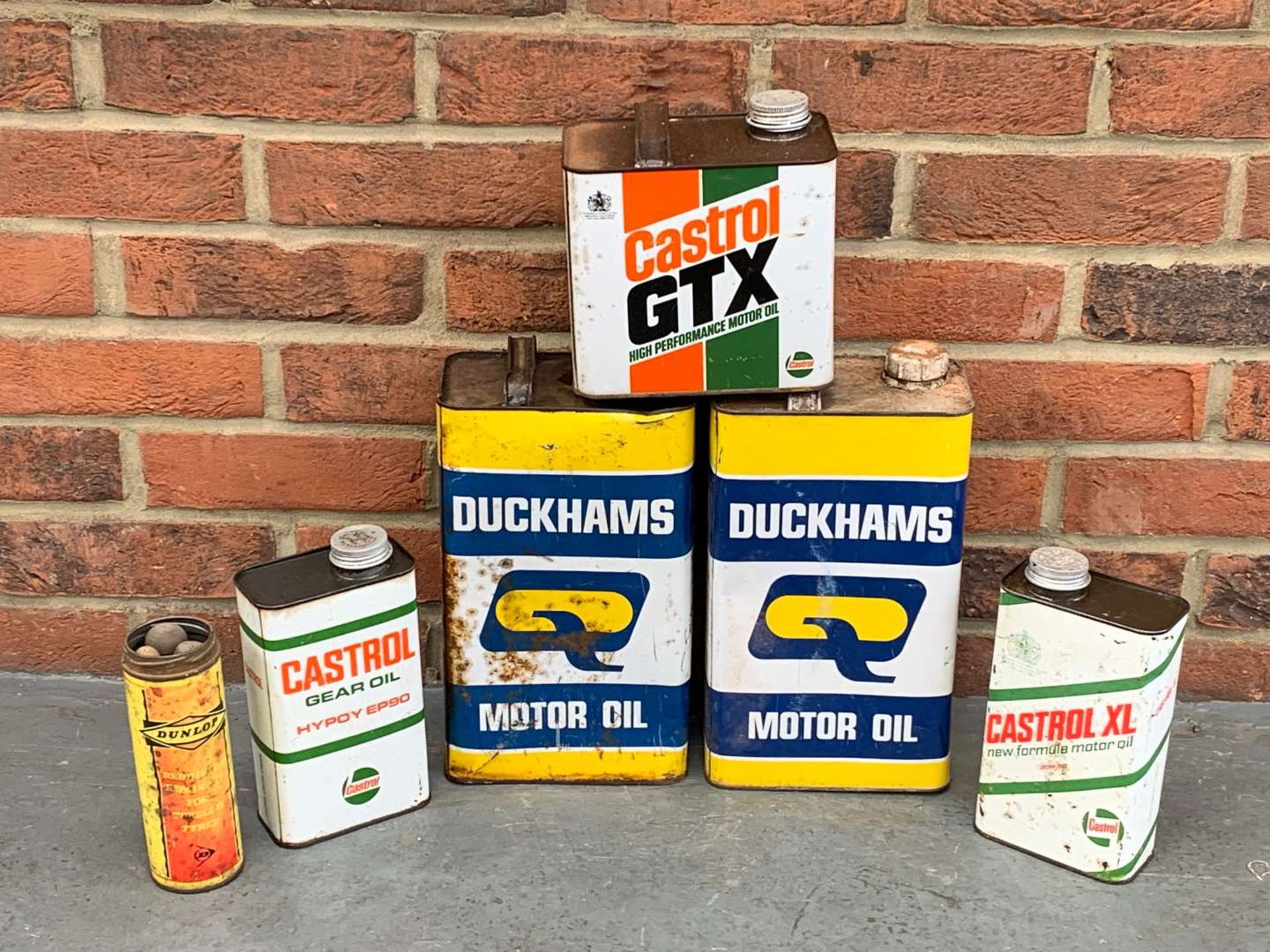 Six Duckhams and Castrol Oil Cans