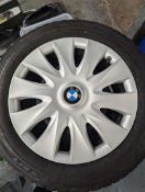 4 BMW 3 SERIES STEEL WHEELS WITH WINTER TYRES AND WHEEL EMBELLISHERS.