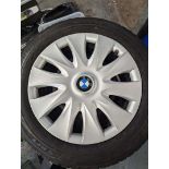 4 BMW 3 SERIES STEEL WHEELS WITH WINTER TYRES AND WHEEL EMBELLISHERS.