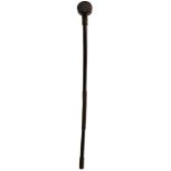 A 19TH CENTURY AFRICAN KNOBKERRIE OR TRIBAL CLUB, 6.5cm circular hardwood head with flattened sides,