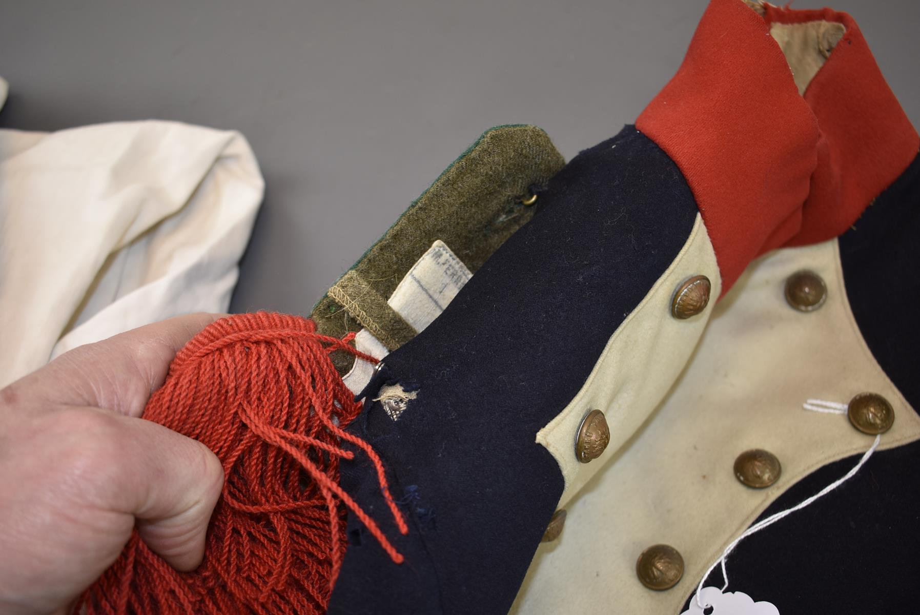 A FRENCH FIREMAN'S FULL DRESS COATEE. Navy blue cloth with scarlet cloth collar, cuffs and turn - Image 6 of 7
