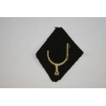 CLOTH BADGE. WW1 period 74th (Yeomanry) Division, a very rare example, black diamond shape with