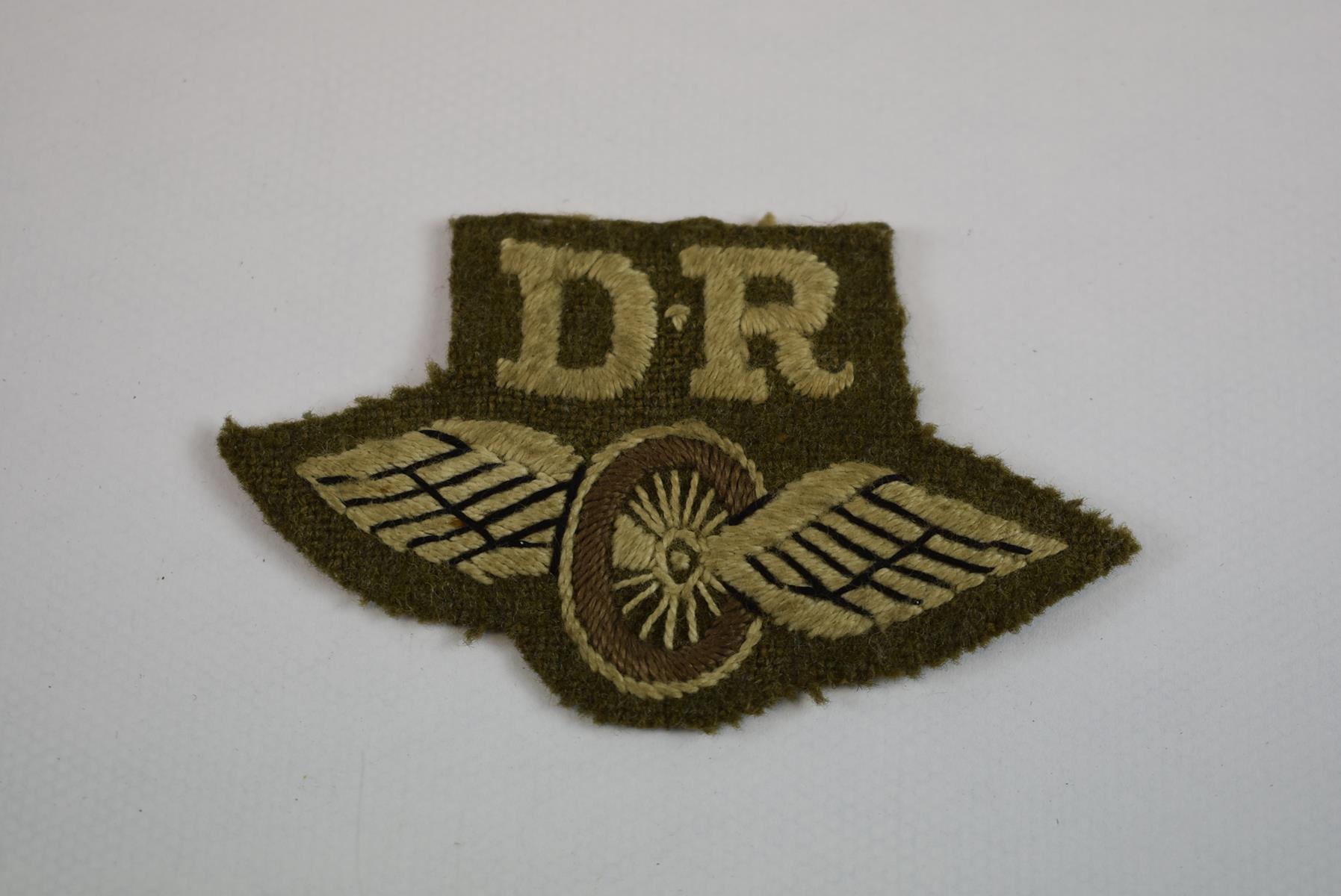 CLOTH INSIGNIA. Comprising a pair of printed 4th Infantry Division arm badges, two (one printed, one