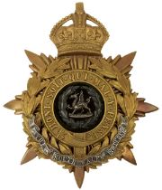 A KING'S CROWN SOUTH WALES BORDERERS BLUE CLOTH HELMET PLATE,