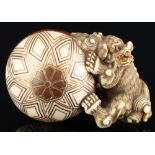 Japan 18th/19th Century, ivory Katabori-Netsuke Shishi with ball, Meiji period,