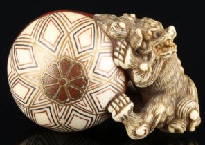 Japan 18th/19th Century, ivory Katabori-Netsuke Shishi with ball, Meiji period,