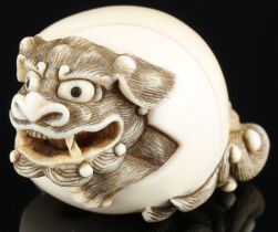 Japan 18th/19th Century, ivory Katabori-Netsuke Shishi in the ball, Meiji period,