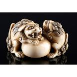 Japan 18th/19th Century, ivory Katabori-Netsuke Shishi pair with ball, Edo period,