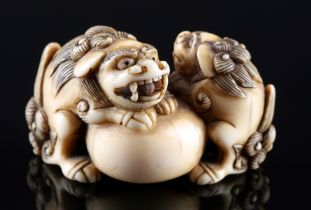 Japan 18th/19th Century, ivory Katabori-Netsuke Shishi pair with ball, Edo period,