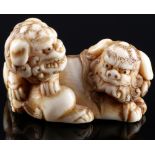 Japan 18th/19th Century, ivory Katabori-Netsuke Shishi pair, Edo period,
