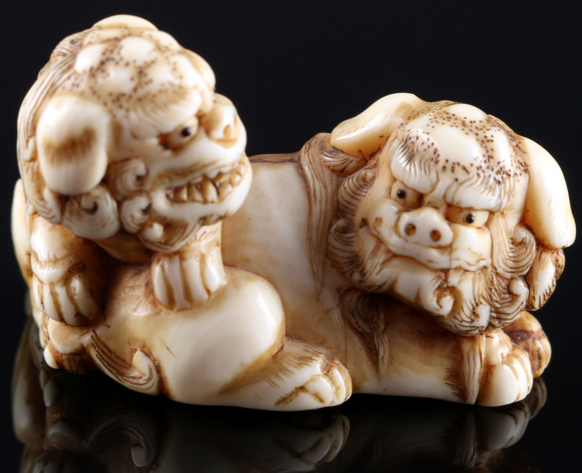 Japan 18th/19th Century, ivory Katabori-Netsuke Shishi pair, Edo period,