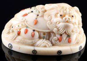 Japan 19th century, ivory netsuke shishi with inlays, Meiji period,