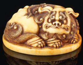 Japan 18th/19th Century, ivory Katabori-Netsuke Shishi lying, Edo period,