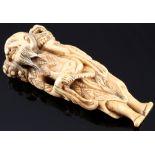 Japan 18th century, ivory Netsuke Senin with shishi, Edo period,