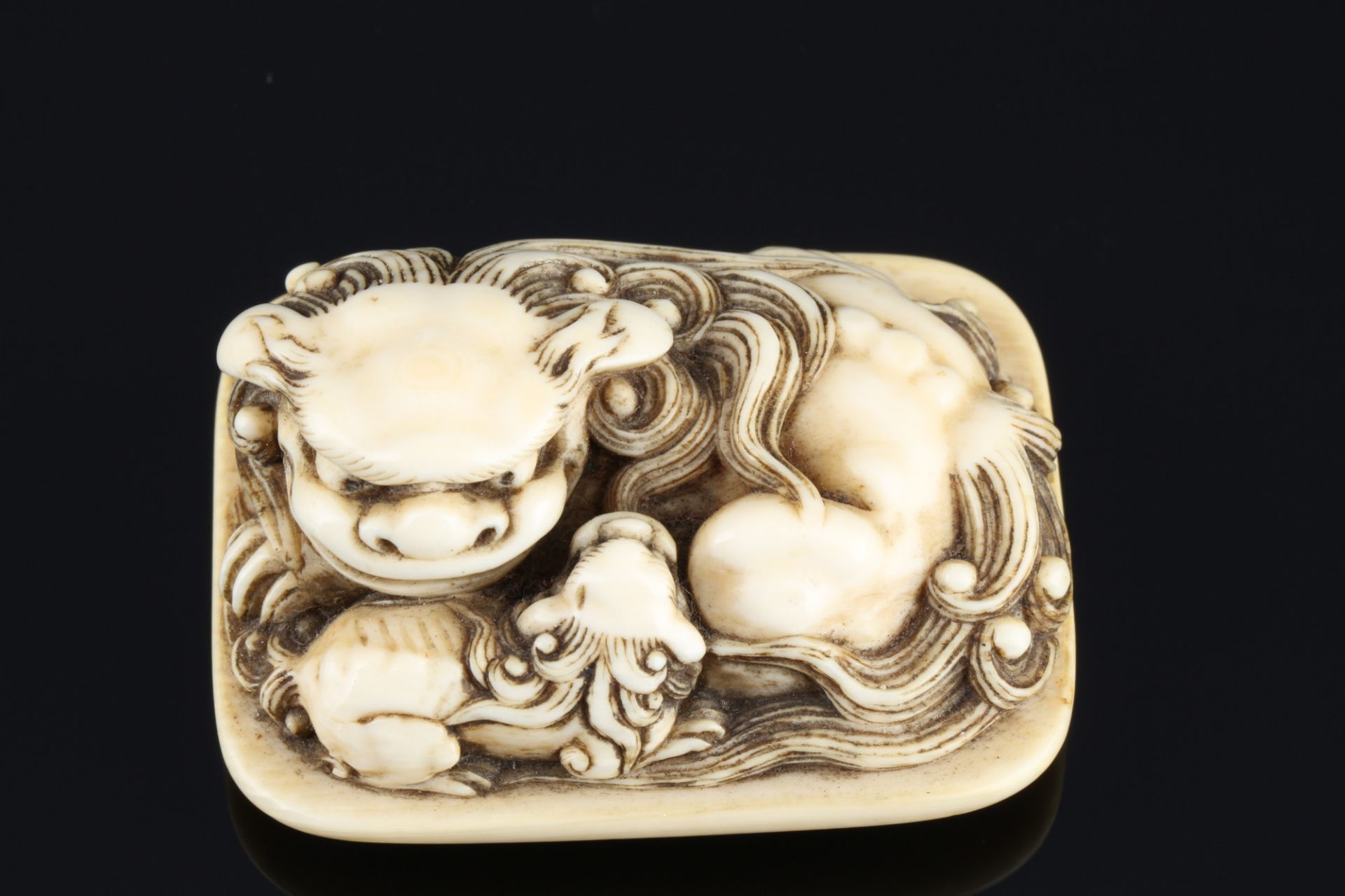 Japan 19th century, ivory Tomochika netsuke shishi with boy, signed, Edo period, - Image 6 of 7