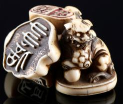 Japan 18th/19th Century, ivory netsuke shishi with seals, Edo period,