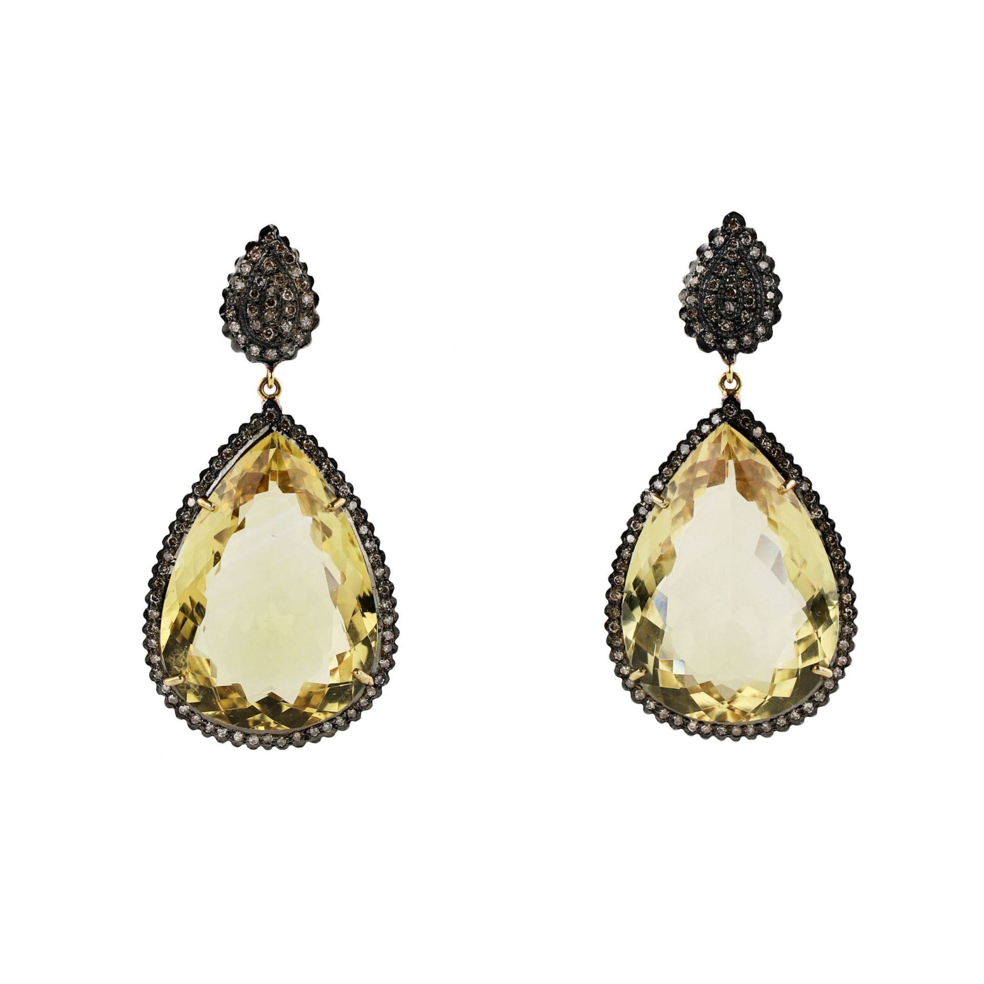 Large, drop-shaped earrings with topazes on silver.