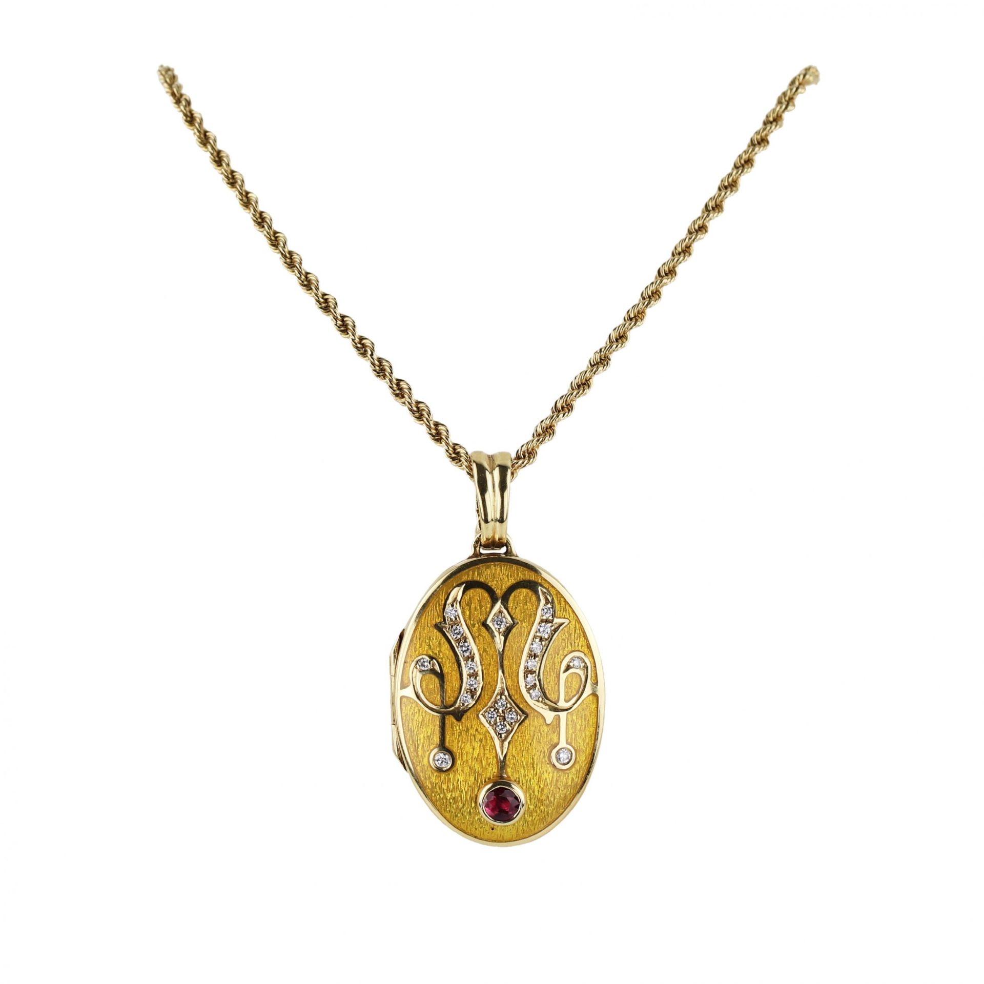 Gold pendant on a chain with a ruby, in the original case. Faberge, France.