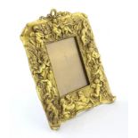 Non-trivial photo frame of gilded bronze in the Neo-Baroque style.