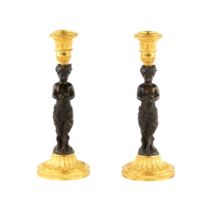 Pair of bronze, French candlesticks, in the form of fauns, mid-19th century.