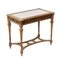 Carved showcase-table of gilded wood, in the spirit of Napoleon III, late 19th century.