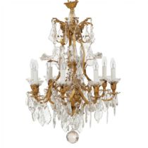 Chandelier in gilded bronze and crystal in neo-Rococo style with eight candles. France.1900