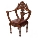 Carved richly decorated walnut chair. 19th century
