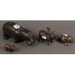 Vier Tierfiguren. Deutsch 20. Jh. Bronze / Eisen. Nilpferd (H=8,5 cm), geflügeltes Schwein (H=7 cm),