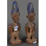 Paar Figuren. Wohl Nigeria ca. 1900. Holz, geschnitzt, teilw. farbig gefasst, Provenienz: Erworben