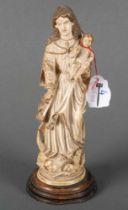 Madonna mit Kind. Südfrankreich 16. Jh. Bein, vollrund geschnitzt, auf Holzsockel montiert.