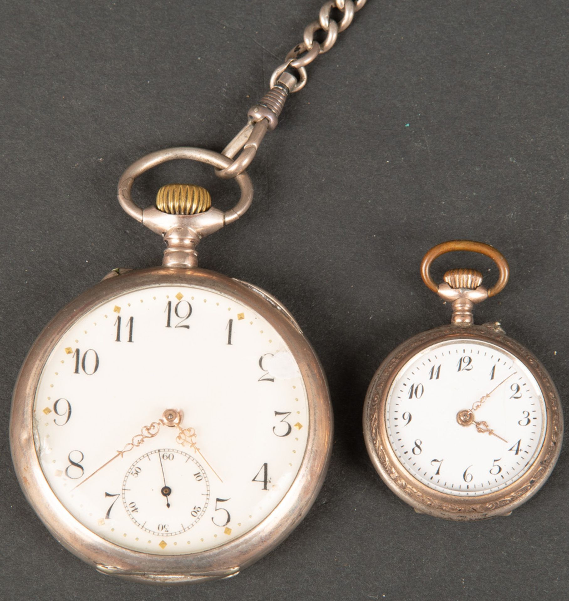 Damen-und Herrentaschenuhr. Dazu eine Uhrenkette, Silber, ca. 151 g. (Funktion ungeprüft)