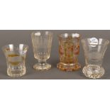 Vier Becher. Böhmen 19./20. Jh. Farbloses Glas, teilw. farbig überfangen, geätzt und beschriftet,