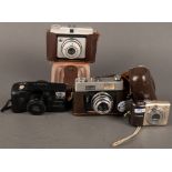 Vier Kameras. Voigtländer Color-Lanthar 2.8/50, Dacora-Digna I, Canon Prima und Canon Power Shot