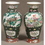 Zwei Vasen. Asien. Porzellan, bunt bemalt, H=je 36 cm. **