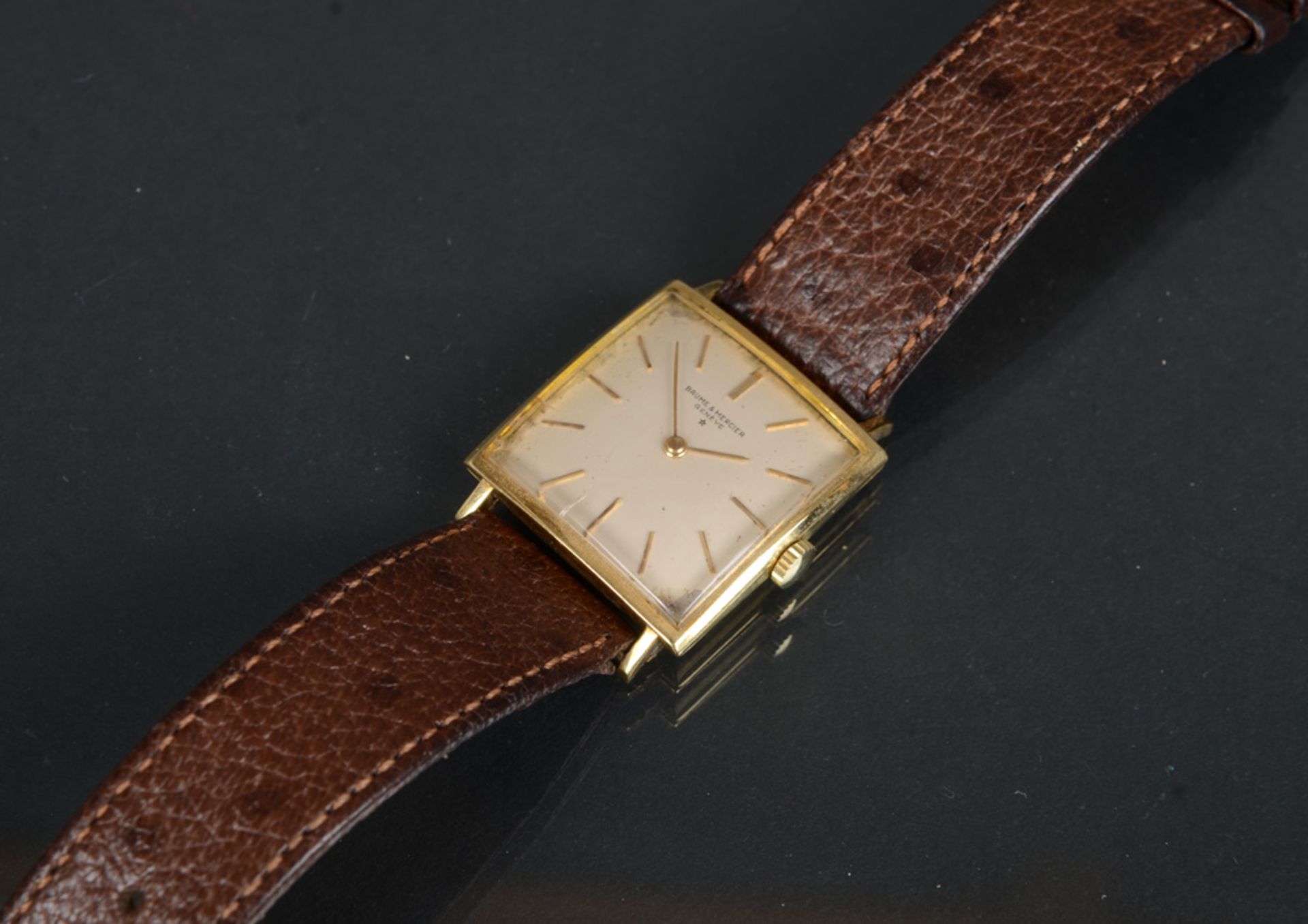 Herrenarmbanduhr. Marke „Baume & Mercier". 18 ct Goldgehäuse. (Funktion ungeprüft)